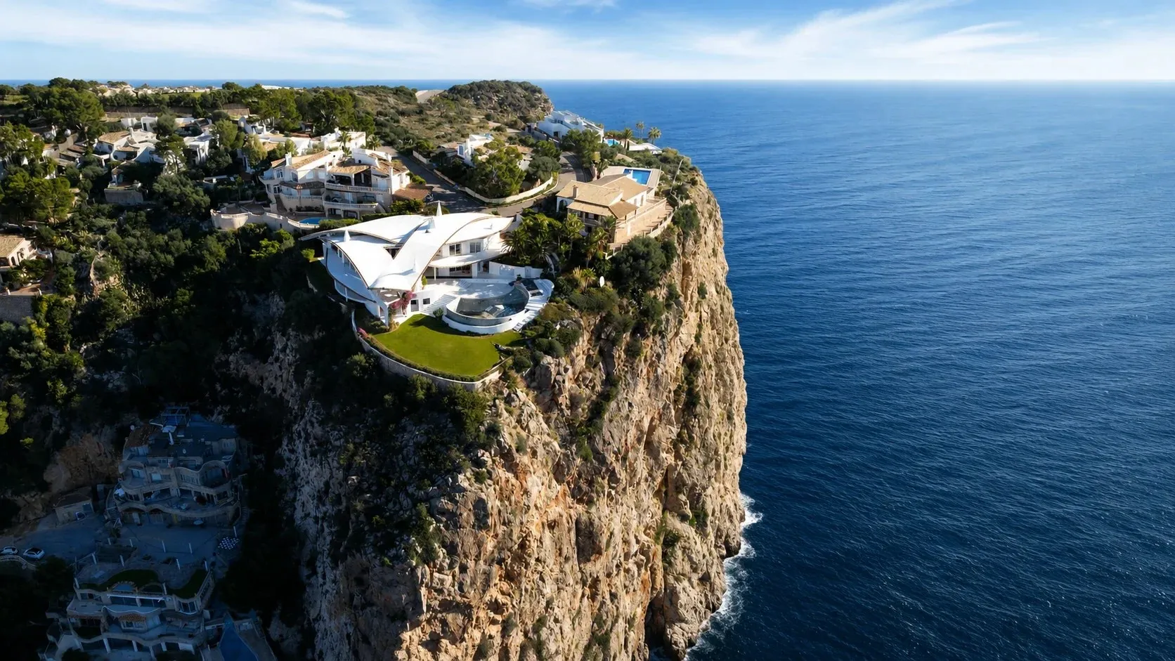 Aerial view of a clifftop villa above the deep blue sea at Port d'Andratx, Mallorca